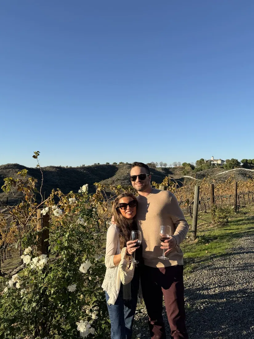 Frankie and Maddie at the vineyard at golden hour