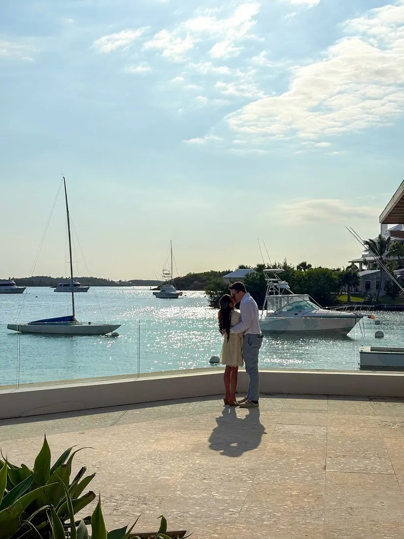 Frankie and Maddie kissing by the harbor
